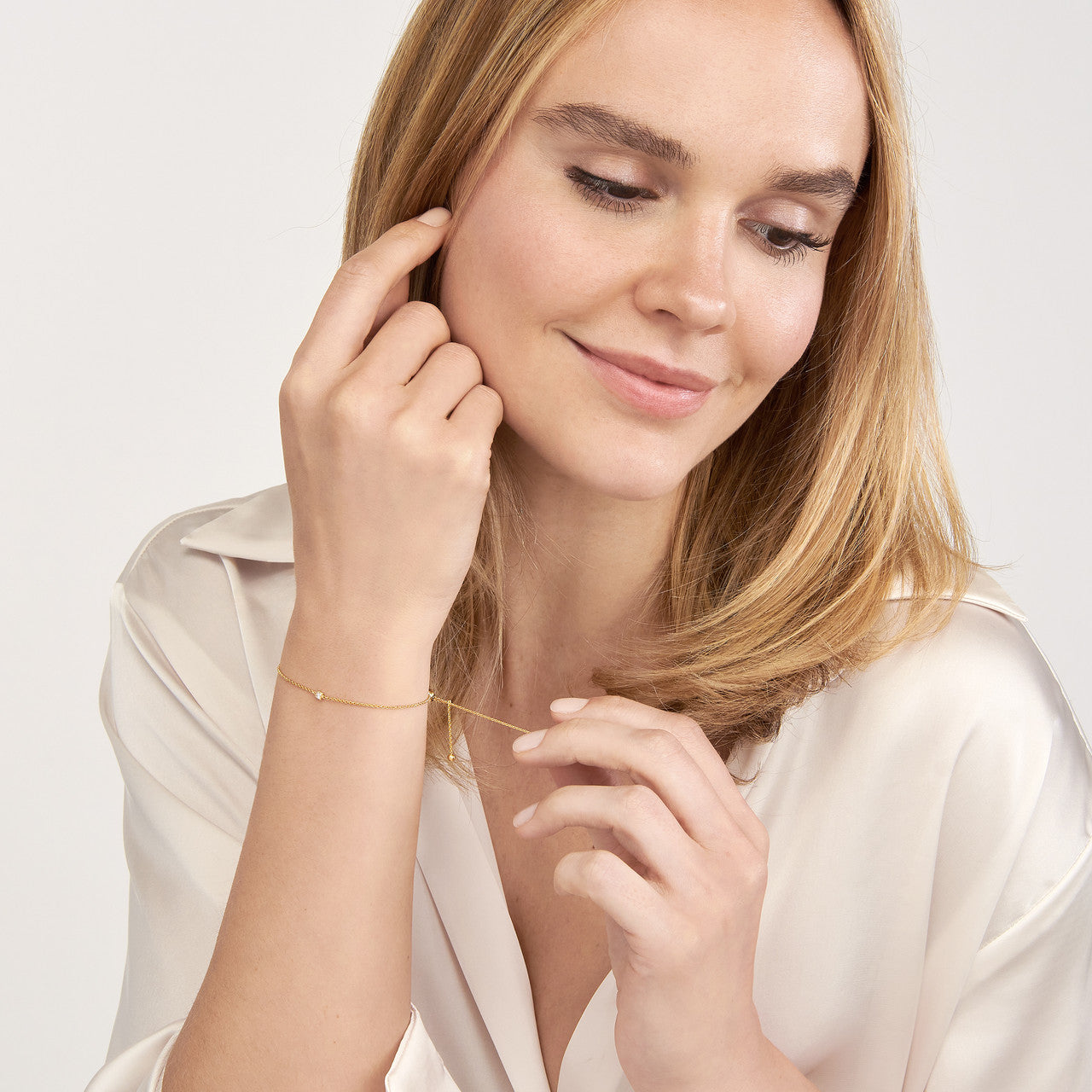 Mini princess cut diamond bolo bracelet featuring a delicate design and adjustable chain for a perfect fit.