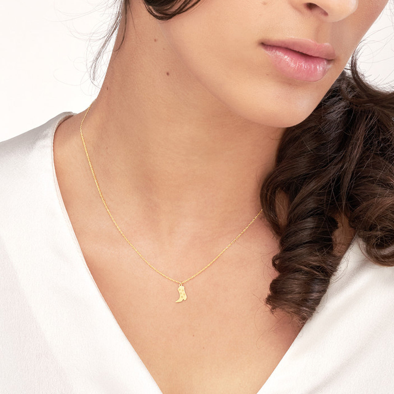 Close-up of a simple Five Stars cowboy boot necklace by My Store, showcasing intricate details and craftsmanship.