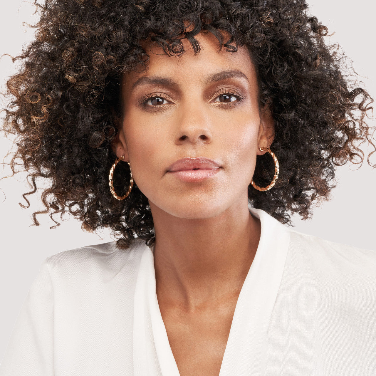Simple 35x3mm tight twist round hoop earrings in gold by My Store, showcasing a sleek and modern design.