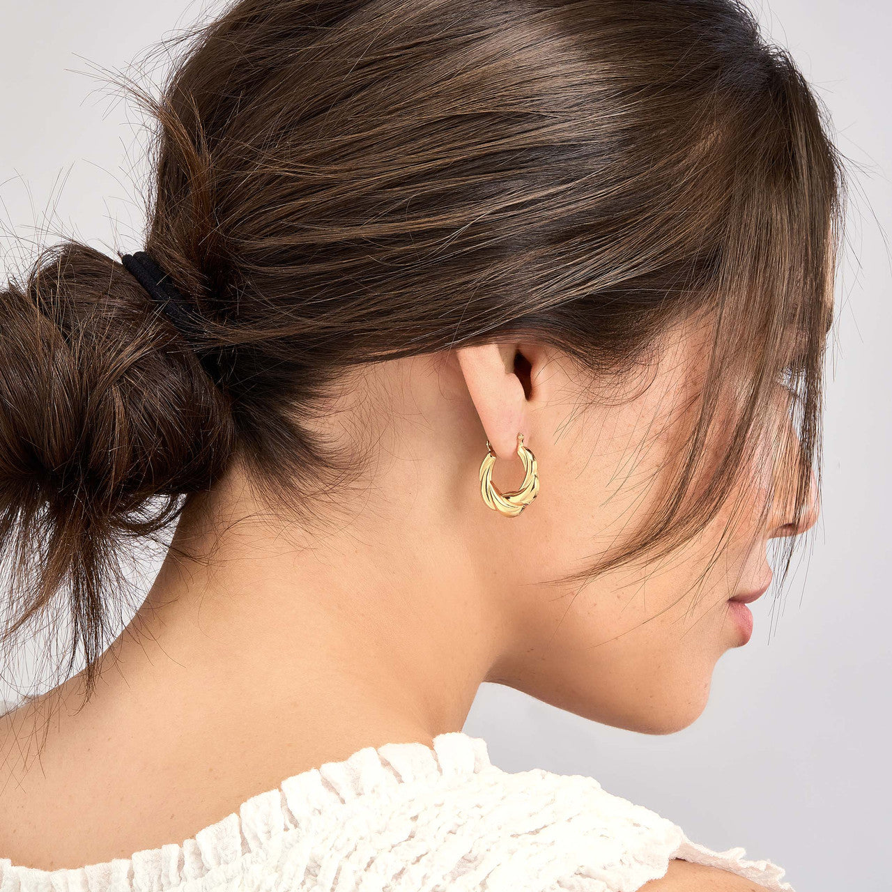 Simple twisted round hoop earrings by My Store in a polished gold finish, showcasing a unique spiral design.